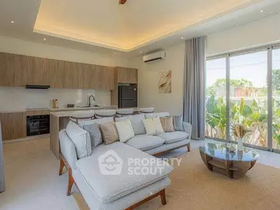 Spacious modern living room with open kitchen and garden view, perfect for relaxation and entertaining.