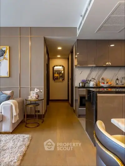 Modern open layout kitchen with sleek cabinetry and cozy living area