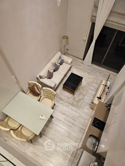 Modern loft-style living room with high ceilings and elegant decor
