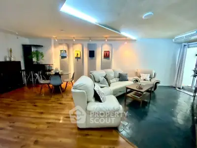 Spacious living room with modern decor and cozy seating area