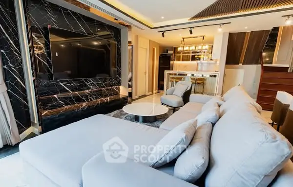 Luxurious modern living room with plush sectional sofa and sleek marble accents