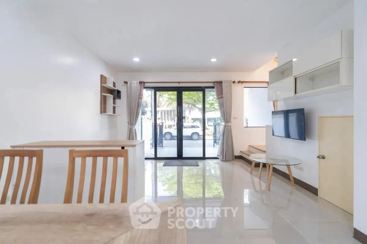 Spacious modern living room with sleek design and large windows for natural light.