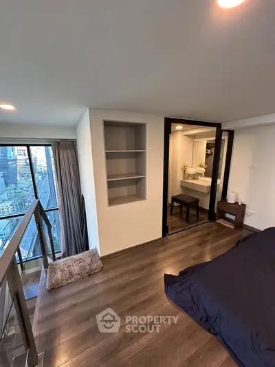 Modern bedroom with city view and sleek wooden flooring