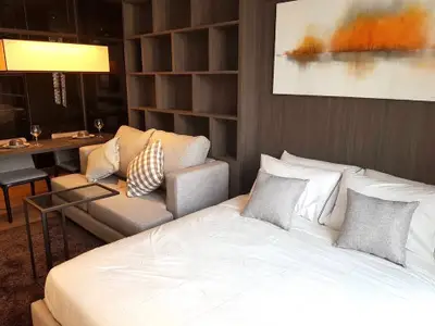 Modern studio apartment with cozy living area and stylish decor