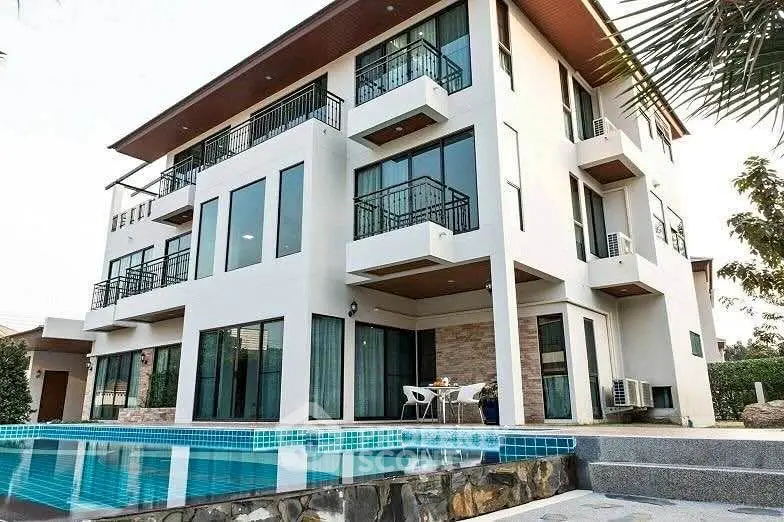 Luxurious modern villa with pool and spacious balconies, perfect for upscale living.