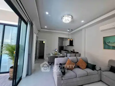 Spacious modern living room with open kitchen and elegant decor