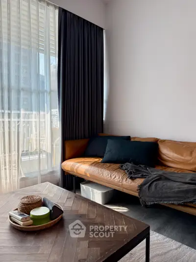 Cozy living room with leather sofa and natural light