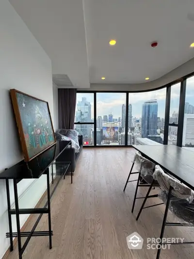 Stunning high-rise apartment with panoramic city views and modern interior design.