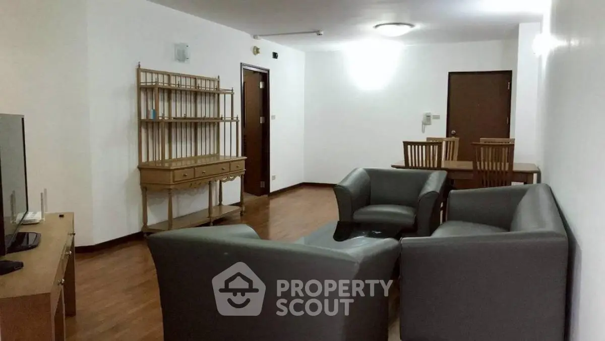 Spacious living room with modern furniture and wooden flooring