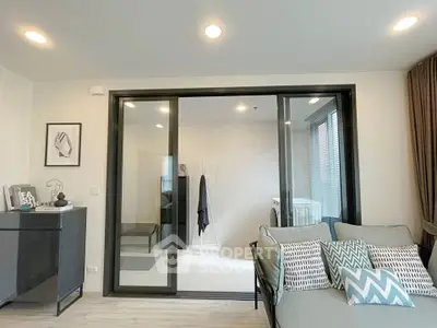 Modern living room with sliding glass doors and stylish decor