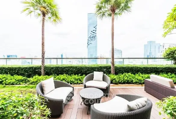 Luxurious rooftop terrace with modern seating and stunning city skyline view.