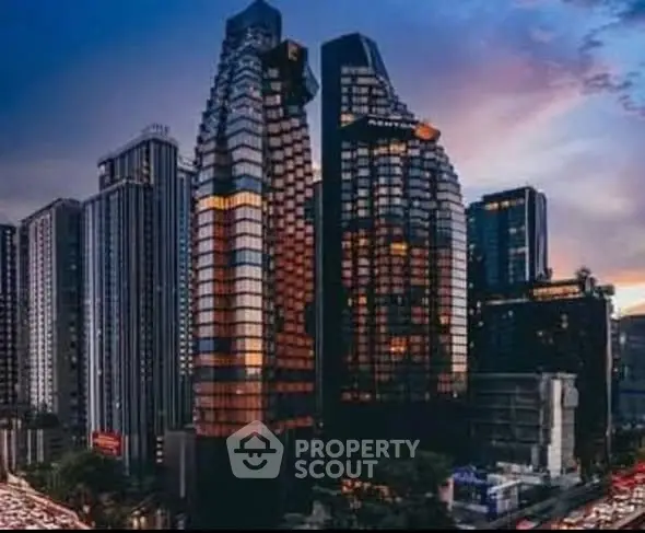 Stunning cityscape view of modern skyscrapers at dusk with vibrant reflections.