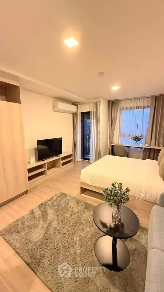 Modern studio apartment with cozy living area and stylish decor