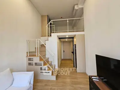 Modern loft apartment with mezzanine and stylish wooden flooring