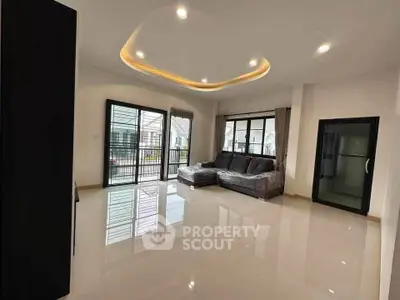 Spacious modern living room with sleek design and ample natural light