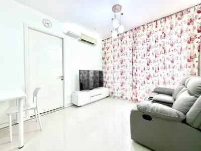 Bright and modern living room with floral curtains and sleek furniture