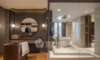 Luxurious modern bathroom with freestanding tub and elegant dressing area.