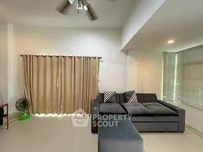 Spacious living room with modern sofa and natural light