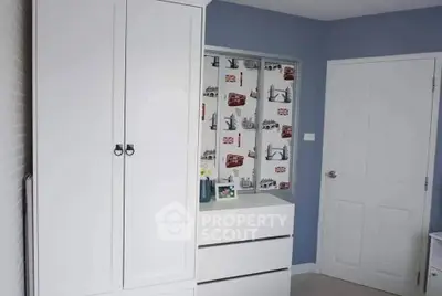 Charming bedroom with modern white wardrobe and stylish decor