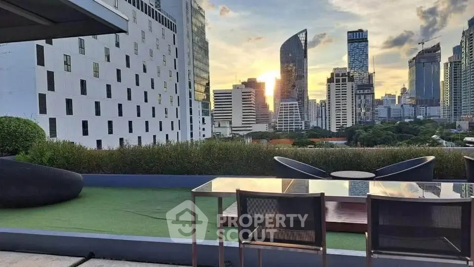 Stunning cityscape view from a modern rooftop terrace with sleek furniture.