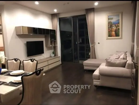 Elegant living room with modern decor and cozy seating area.