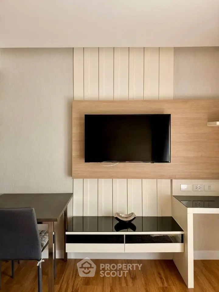 Modern living room with sleek TV setup and stylish furniture