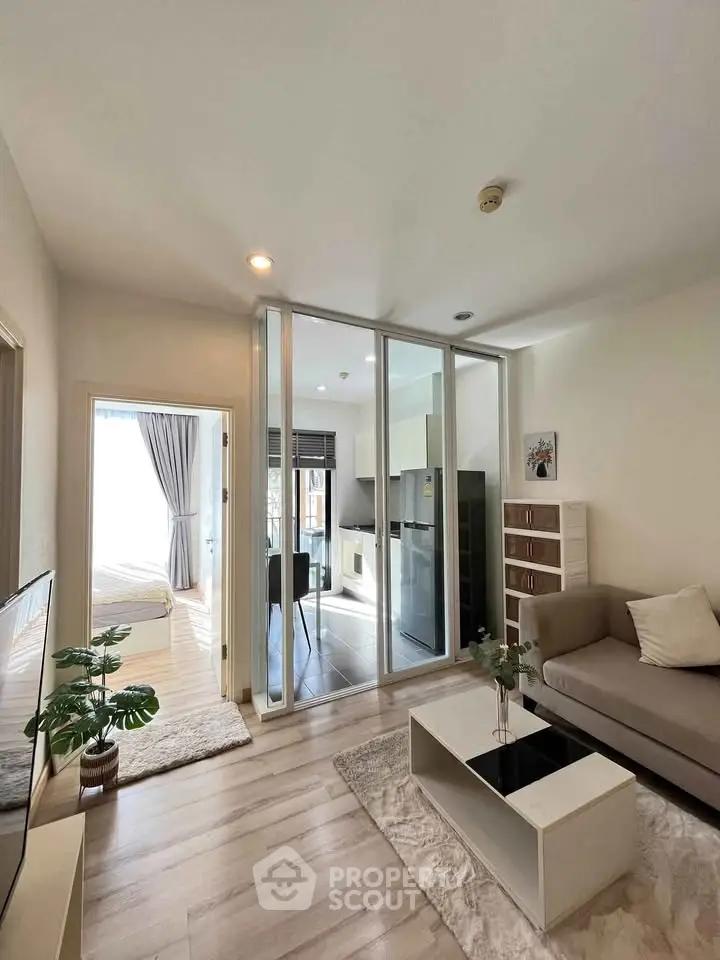 Modern living room with open layout, stylish furniture, and natural light, perfect for urban living.