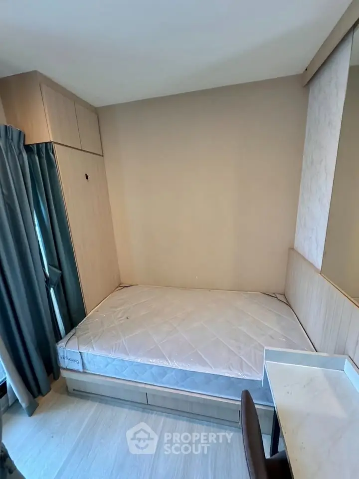 Cozy bedroom with built-in storage and natural light