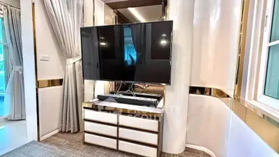 Luxurious living room with modern TV setup and elegant decor