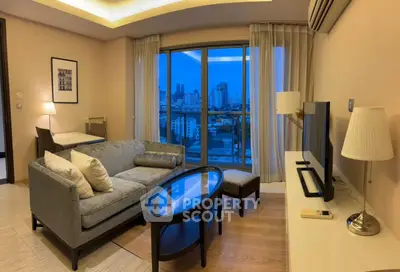 Modern living room with city view and stylish furniture in high-rise apartment.