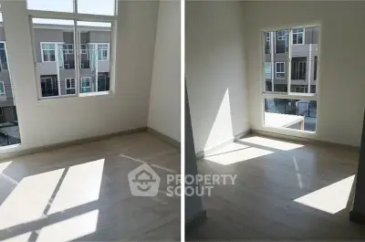 Bright empty room with large windows and wooden flooring, perfect for customization.