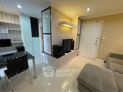 Modern living room with sleek design, featuring a cozy sofa, TV unit, and stylish shelving, perfect for urban living.