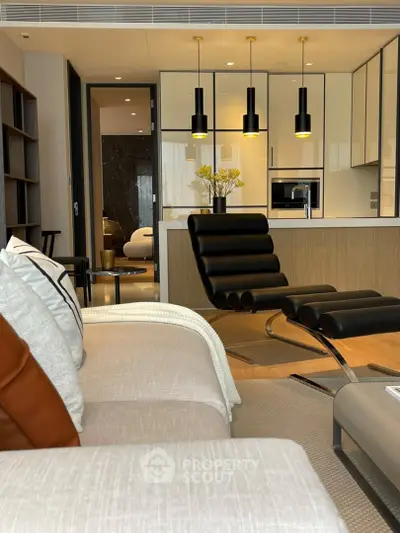 Luxurious modern living room with sleek furniture and stylish lighting in a contemporary apartment.