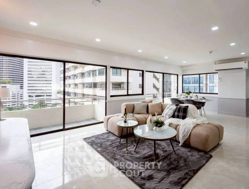 Spacious modern living room with city view and elegant decor