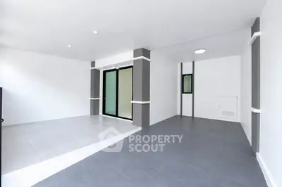 Spacious modern interior with sleek tile flooring and minimalist design