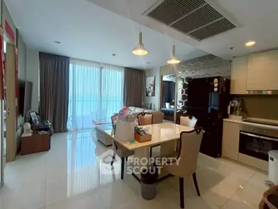 Modern open-layout kitchen and dining area with stylish decor and ample natural light.