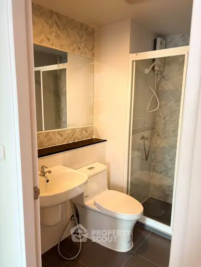 Modern bathroom with glass shower and stylish tile design