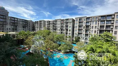 Luxurious condominium with lush gardens and a stunning pool view