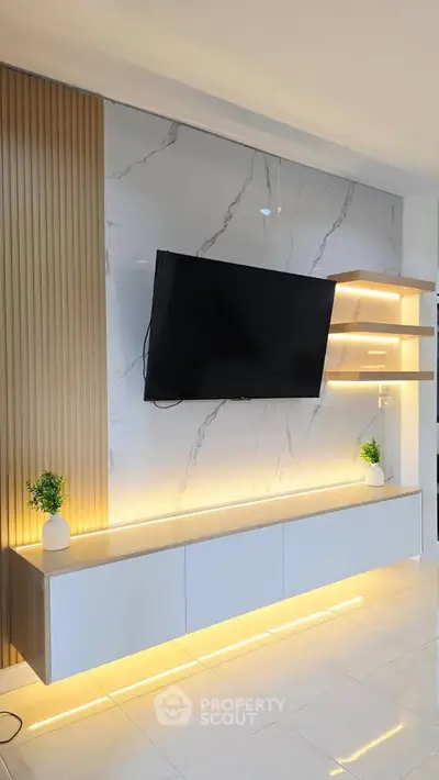 Modern living room with sleek TV unit and ambient lighting