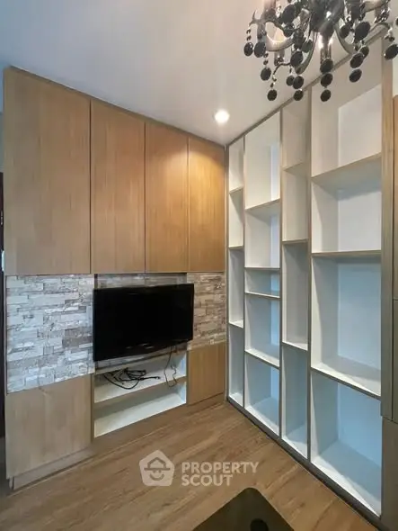 Modern living room with built-in TV unit and stylish shelving