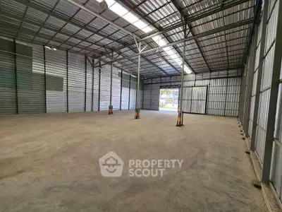 Spacious industrial warehouse with high ceilings and ample natural light