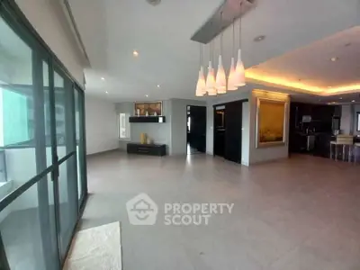 Spacious modern living room with elegant lighting and open layout