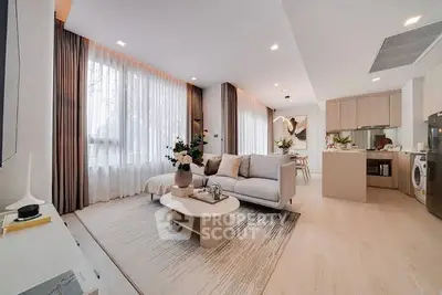 Modern open-plan living room with elegant decor and natural light