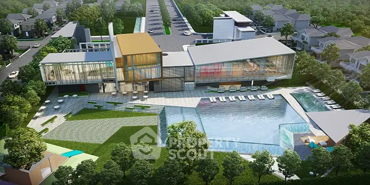 Stunning aerial view of modern luxury complex with pool and lush greenery.