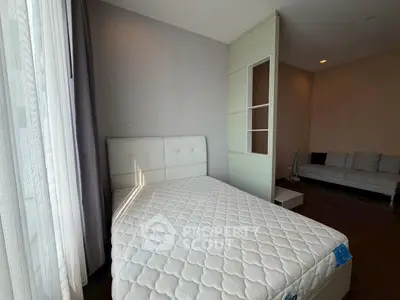 Modern bedroom with natural light and stylish decor