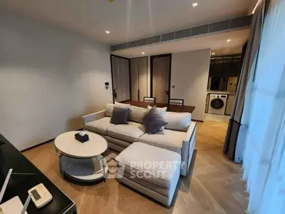 Modern living room with elegant furniture and open kitchen layout