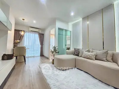 Modern living room with elegant decor and natural light in a stylish apartment.