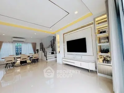 Spacious modern living room with elegant dining area and stylish staircase