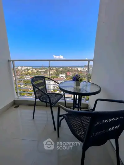 Stunning balcony with panoramic city view, perfect for relaxation and enjoying the skyline.