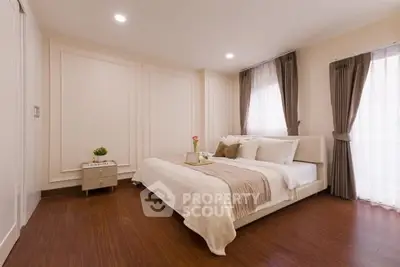 Elegant bedroom with cozy decor and natural light